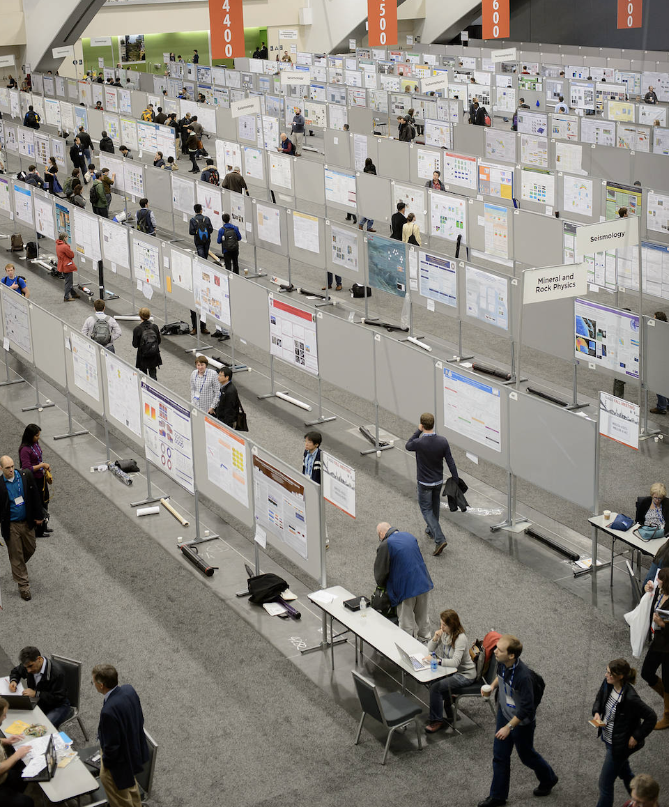 photo of hall with bulletin boards and people