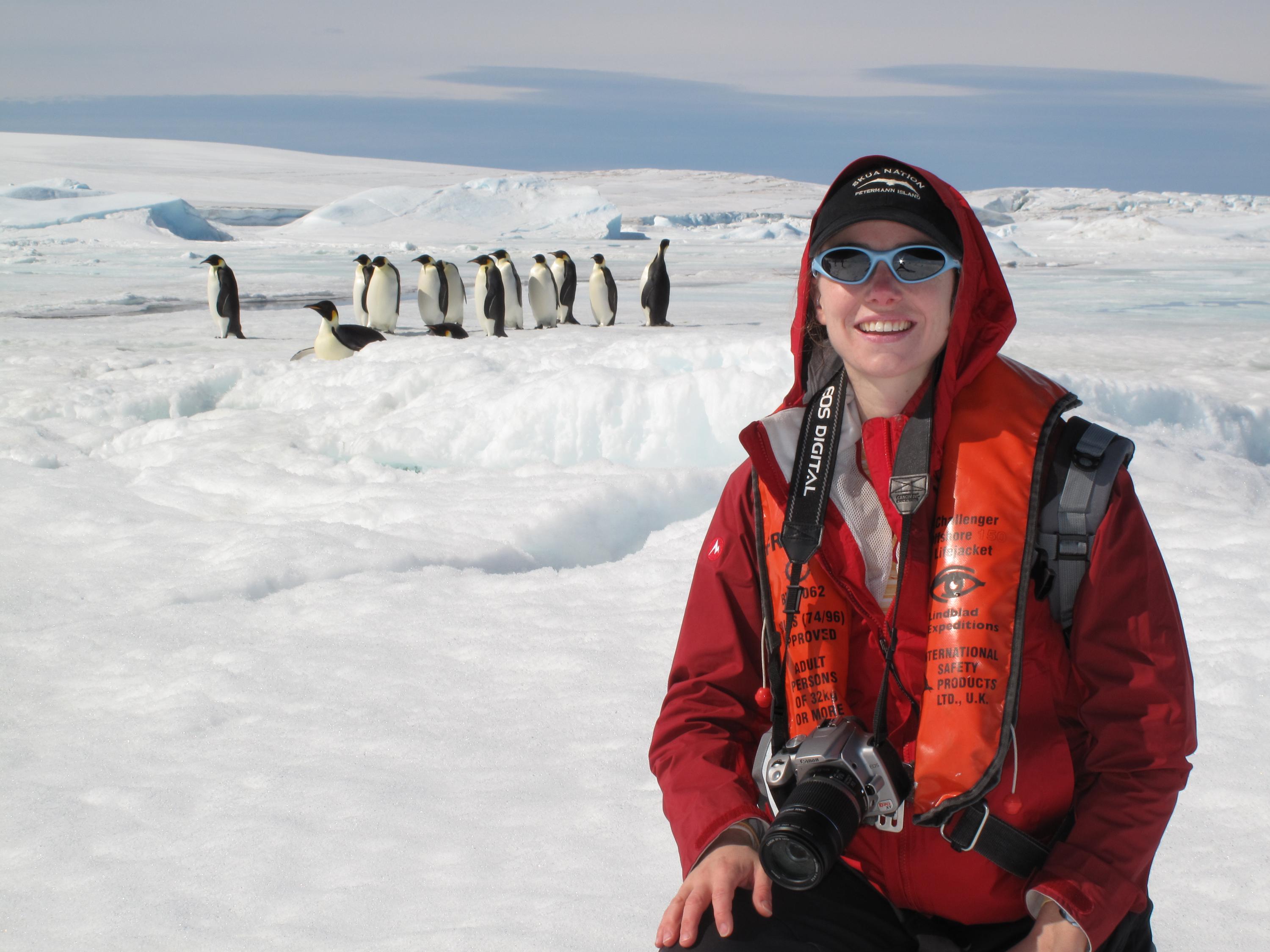 photo of Heather Lynch with emperor penguins