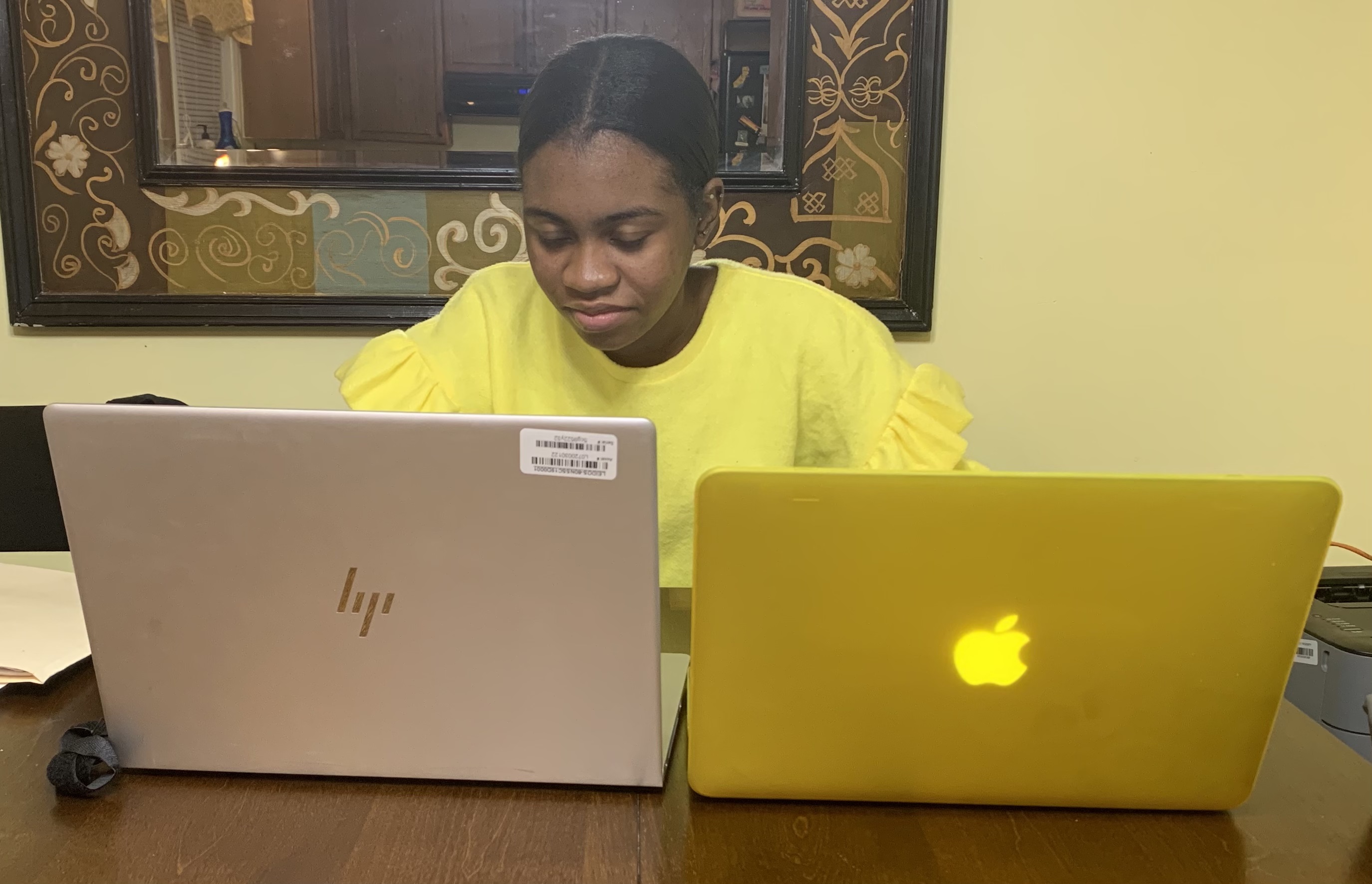 Woman with two laptops