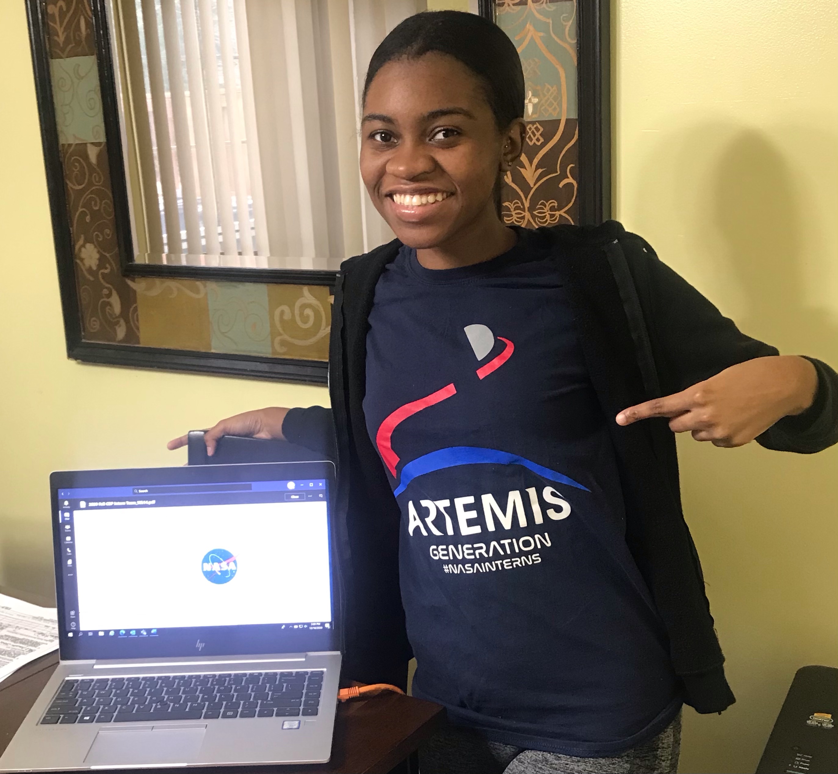 Woman working from home NASA shirt