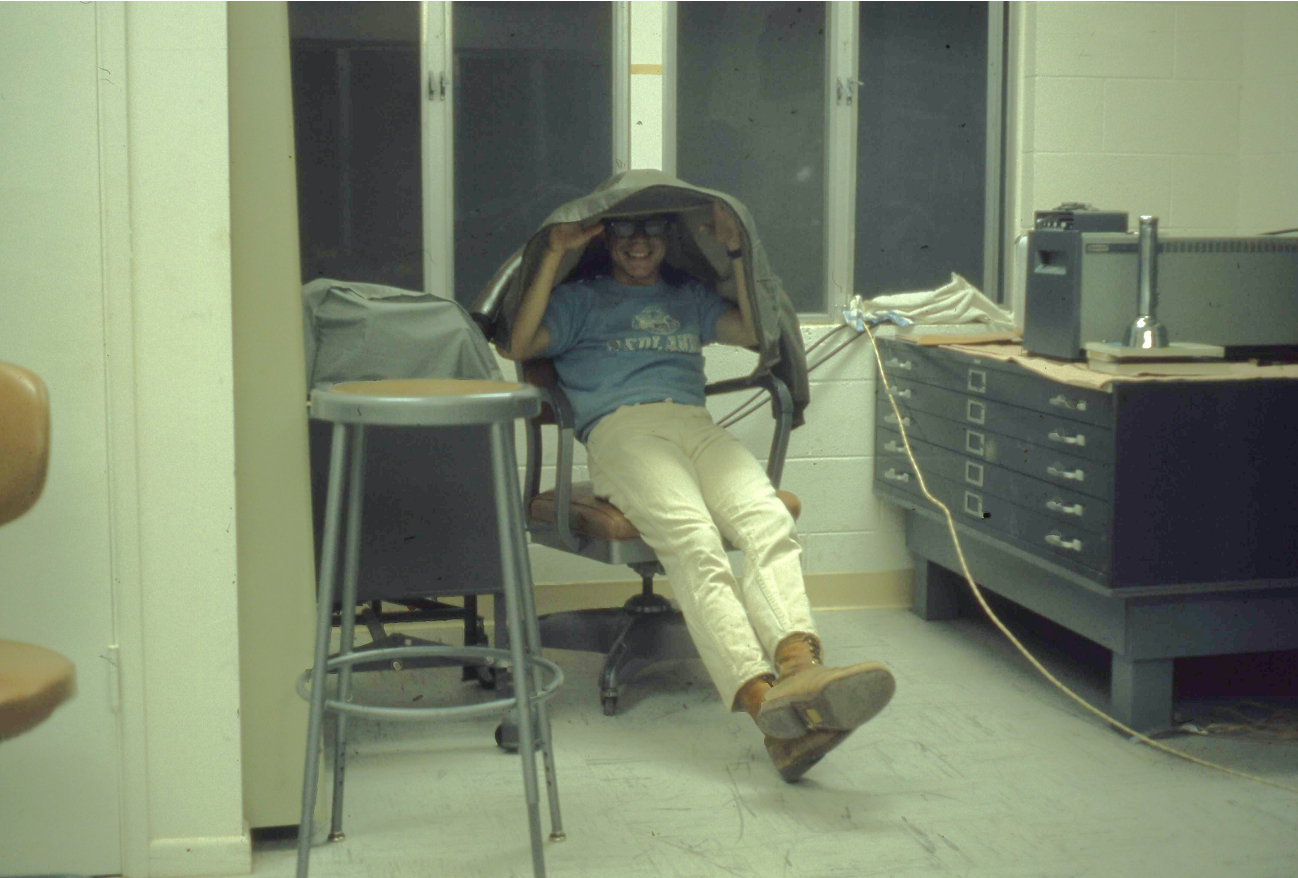 man in lab under jacket