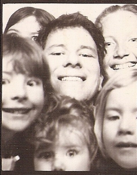 6 people, Ila White's family members, crowd into the frame of a sepia-tone photo.