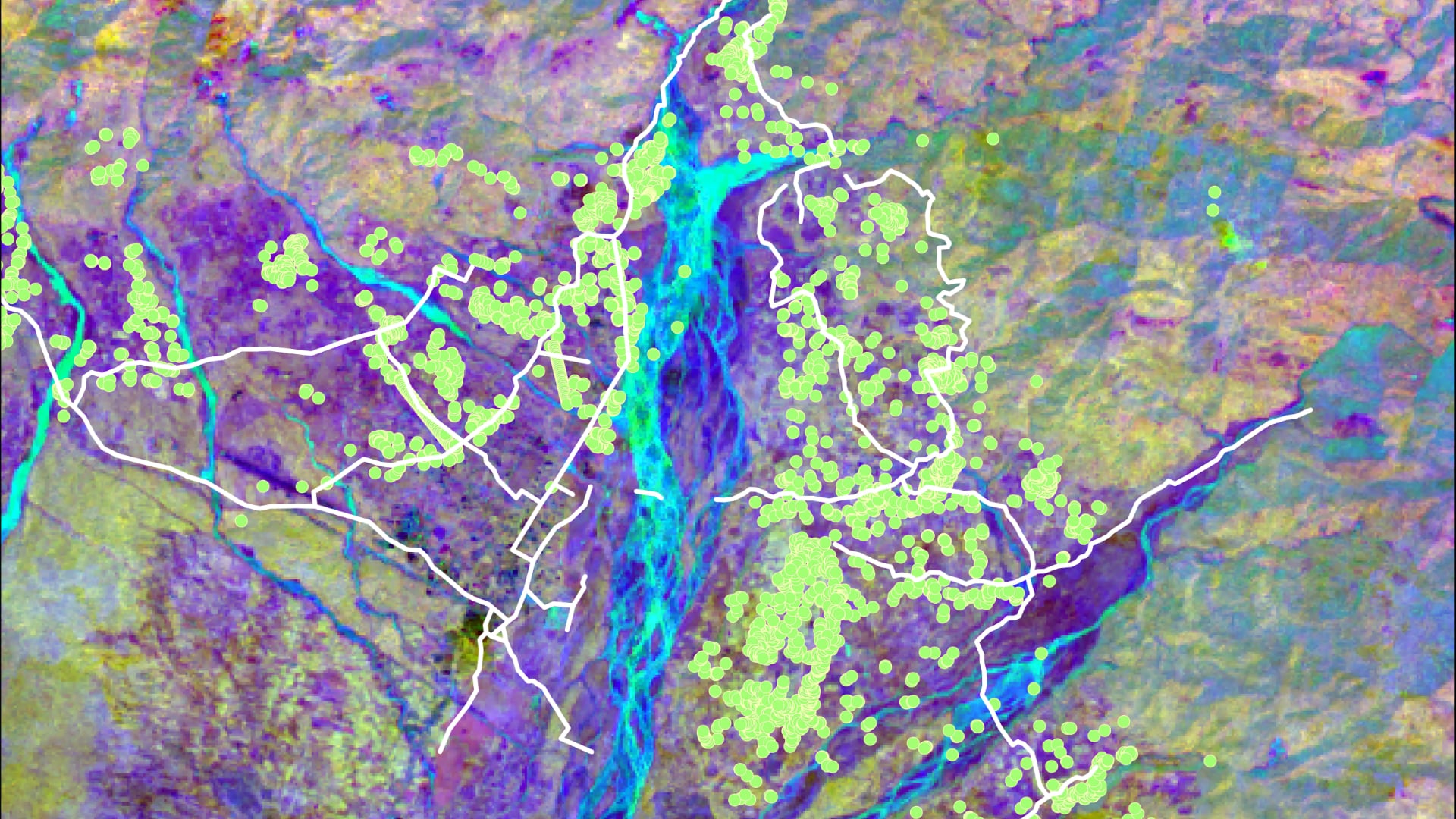 2020 Landsat 8 OLI data processed using principal component analysis with a band combination of 2, 3, and 9. Human settlements and roads are indicated by the green dots and white lines, respectively. The area displayed is the town of Gelephu along the southern border of Bhutan. Different colors represent different land cover types. This will provide information on land change trends which will assist partners in urban planning and allocation of wildlife corridors.  Keywords: remote sensing, Asian elephant habitat, Bhutan, LULC change mapping, LULC change forecasting, wildlife corridor mapping