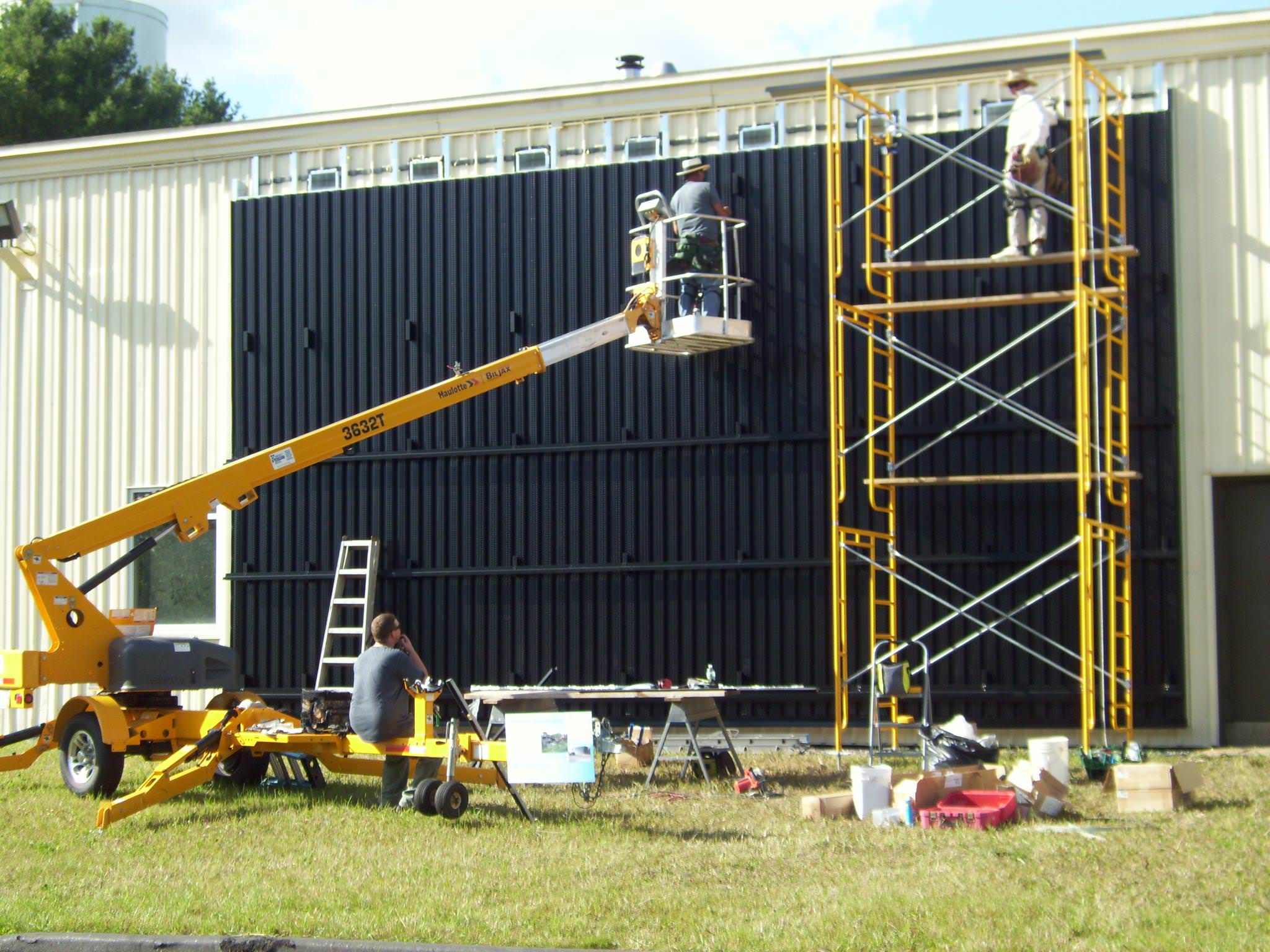 The installation of a solar wall at Wicked Joe's roastery.