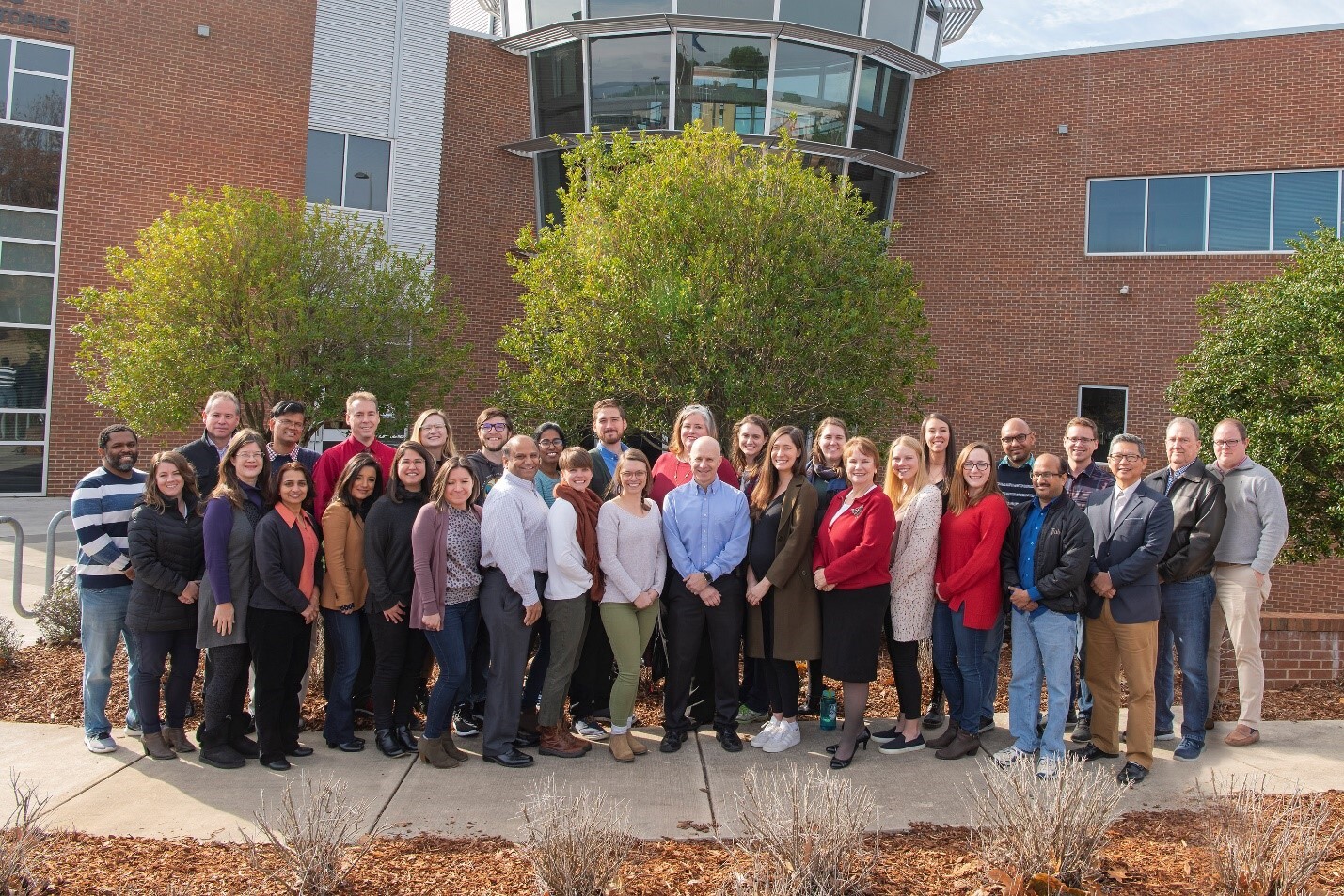 Team in front of office