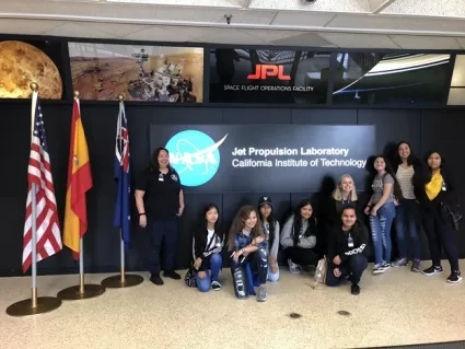 photo of women in front of flags