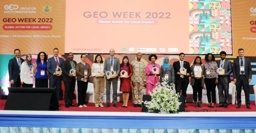 Photo of people on a stage holding awards