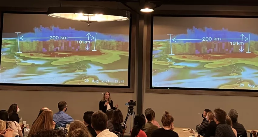 photo of woman presenting science 