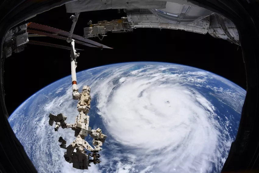 Hurricane Ida is pictured as a category two storm from the International Space Station as it orbited 263 miles above the Gulf of Mexico. At left, from top to bottom, are the Nauka multipurpose laboratory module, the Soyuz MS-18 crew ship and the Northrop Grumman Cygnus space freighter. Credits: NASA, International Space Station