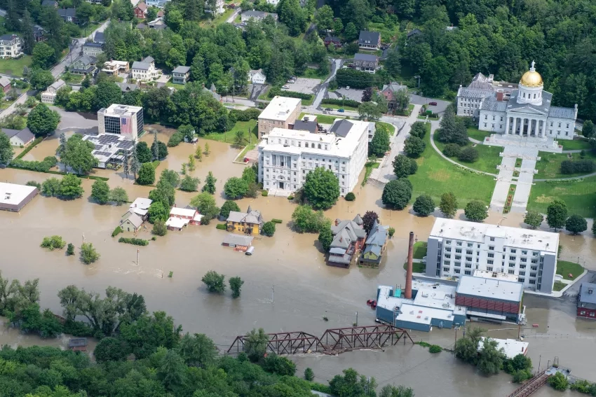 A Vermont National Guard helicopter surveys flood damage in the state's capital, Montpelier, Vt., July 11, 2023. Credits: U.S. Department of Defense, Air Force Senior Master Sgt. Michael Davis