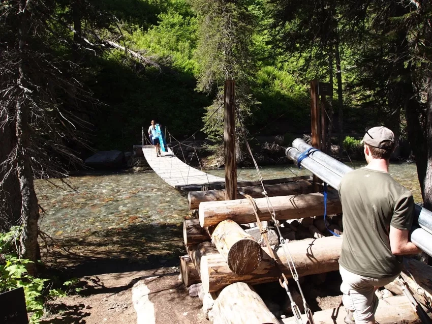 CAPTION: Oddo doing field work in Glacier National Park, Mont. through the Keck Geology Consortium. One of the hardest parts about coring glacial lakes was hauling out the samples. Credits: Amy Myrbo 