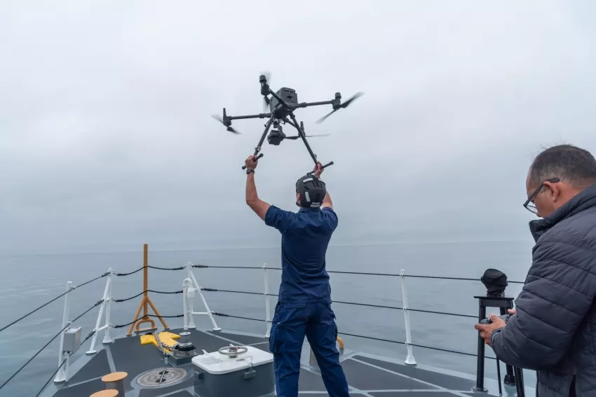 A crewmember of the Coast Guard cutter Blackfin releases a drone as part of Marine Oil Spill Thickness field campaign off the coast of Santa Barbara, CA. The drone carries a multi-spectral sensor to classify oil thickness. These data are compared with SAR imagery from NASA’s aircraft UAVSAR. Oscar Garcia (right) of the Watermapping LLC controls the drone. Credits: NASA/University of Maryland/Frank Monaldo