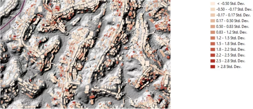 The relative exposure of buildings to a landslide hazard shown in shades of red, with the darkest red color signifying those most highly exposed to landslides.