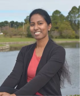 Woman in front of duck pond