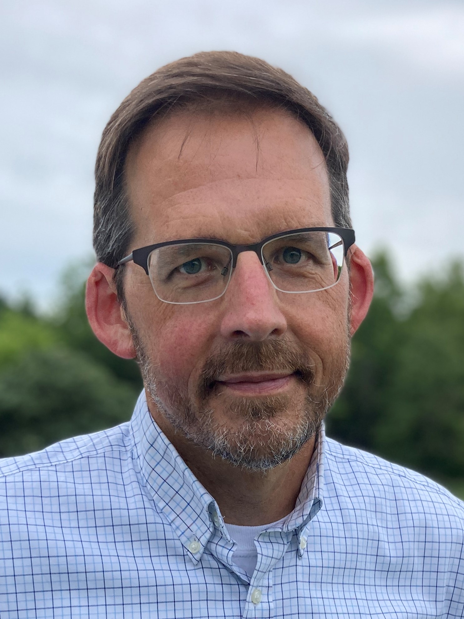 photo of man in glasses smiling