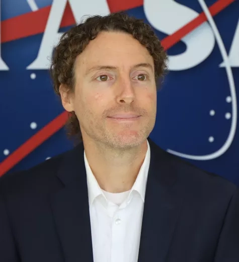 Sean Pictured in front of the original NASA logo