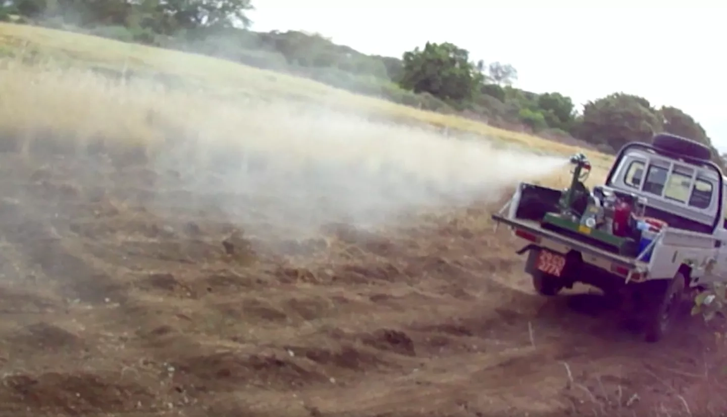 Photo of mosquito spraying from back of pickup truck