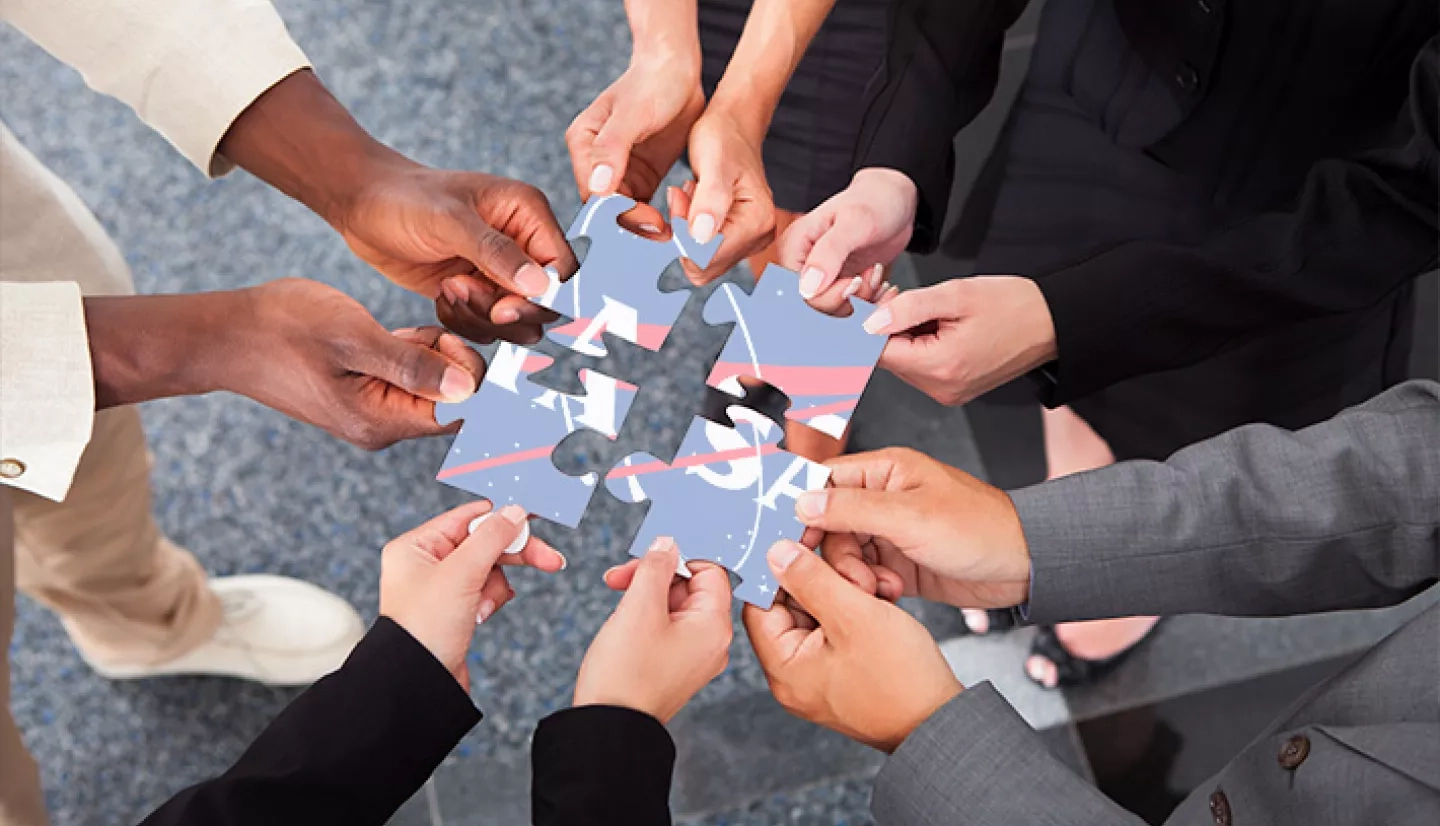 Photo of human hands holding a puzzle piece