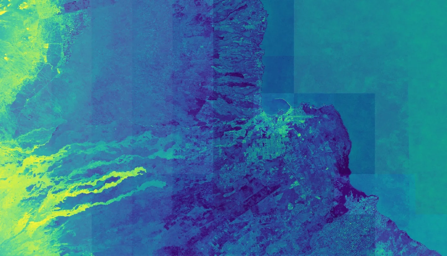 Normalized Difference Moisture Index (NDMI) processed 2021 Landsat 8 OLI imagery over land and Sentinel-2 MSI over ocean, ranging from yellow (low) to blue (high), for Hilo, Hawaii. Overlayed with four-day rainfall accumulation cells in blue acquired during Hurricane Lane (Aug 22-25, 2018) from CHIRPS Daily. NDMI monitors water content of leaves and is useful for classifying land cover. Impervious surfaces and areas that have received excessive historical rainfall are susceptible to future flood events.
