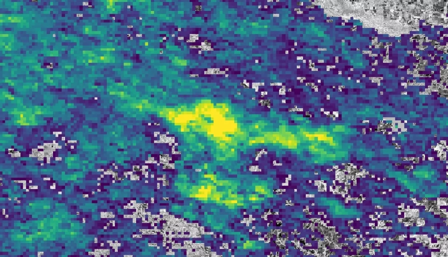 The difference in Aerosol Optical Depth (AOD) between ozone spike days in summer 2018 and 2020 in Seiling, Oklahoma. AOD measures particles distributed within a column of air and can help predict tropospheric ozone spikes and inform regulatory organizations. Data derived from Terra and Aqua MODIS with 2020 Landsat 8 imagery as a base map. Yellow represents the greatest difference in AOD and purple represents the least difference, with green in the middle. Areas with negative values were removed. 