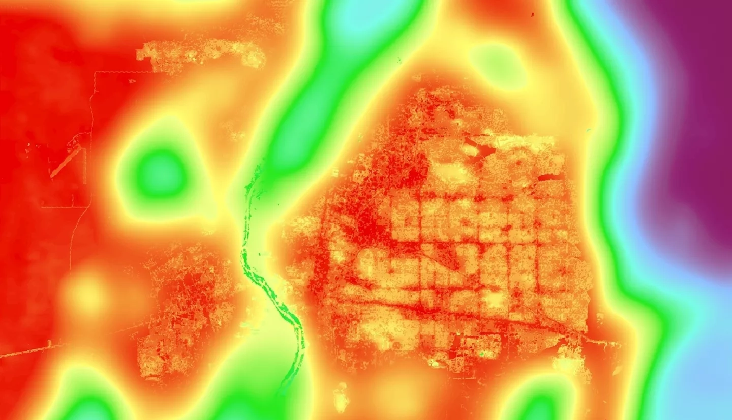 Heat Mitigation Index calculated from a composite 2019-2021 ISS ECOSTRESS evapotranspiration image, run with other environmental data through the InVEST Urban Cooling model. The warmer colors indicate an area that does a worse job at mitigating urban heat. The purple in the east shows the Sandia Mountains, and the green through the middle surrounds the Rio Grande. Heat mitigation indices help urban foresters plan where to plant trees to reduce the urban heat island effect.