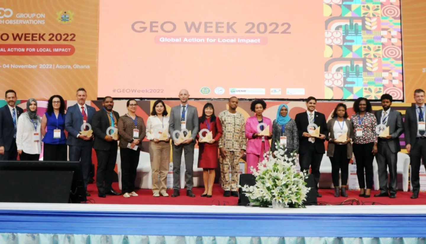 Photo of people on a stage holding awards