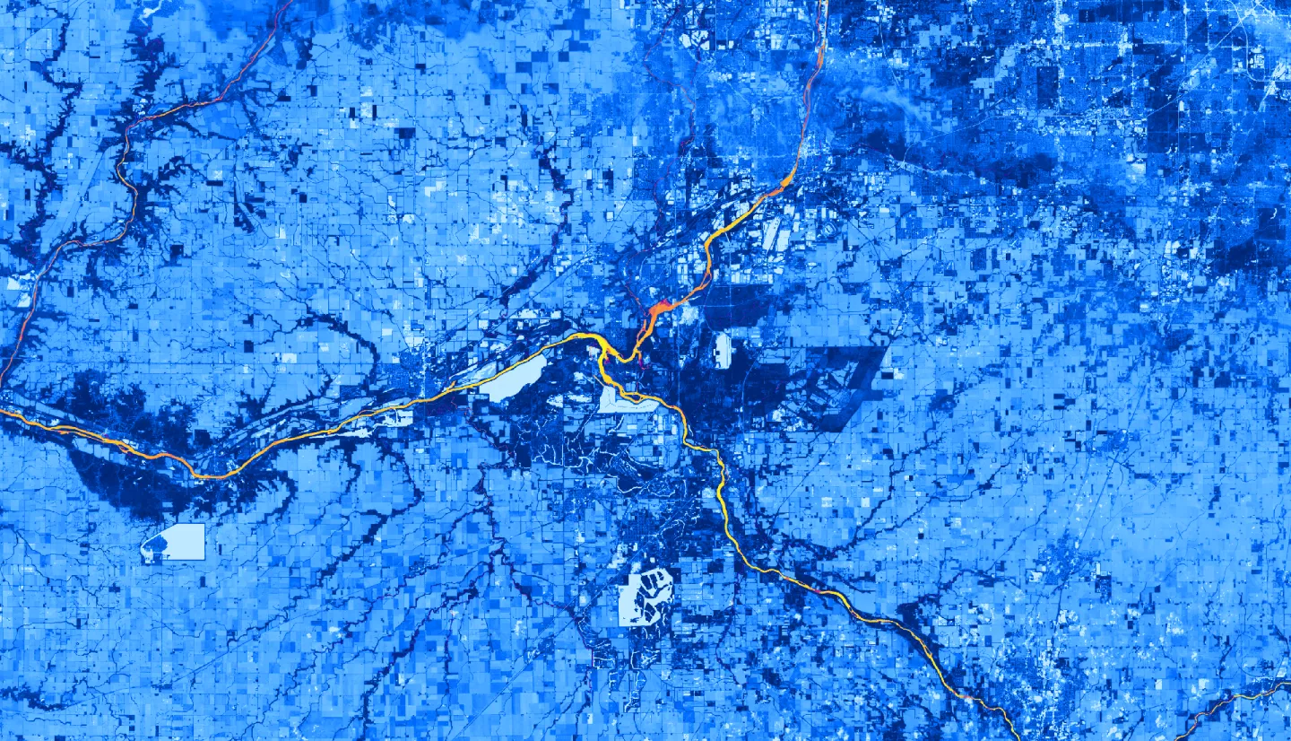 Normalized difference vegetation index (NDVI) calculated from Landsat 8 OLI showing land and aquatic vegetation around the Kankakee River in northeast Illinois on June 9, 2022. For land, dark blue represents high vegetation while light blue represents low vegetation. For water, light orange represents lack of aquatic vegetation, while purple represents the presence of aquatic vegetation. The image shows where along the Kankakee River aquatic vegetation exists. 