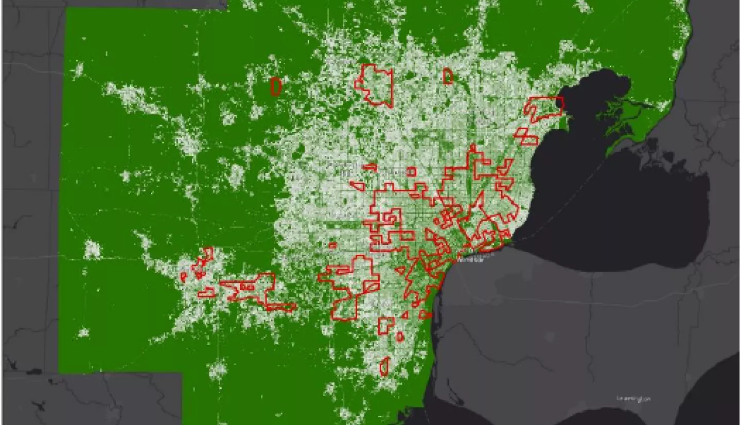 Map of SEMCOG study area showing regions identified by SEMCOG as areas of persistent poverty, overlaid on a map of percent impervious surface for the seven county region.