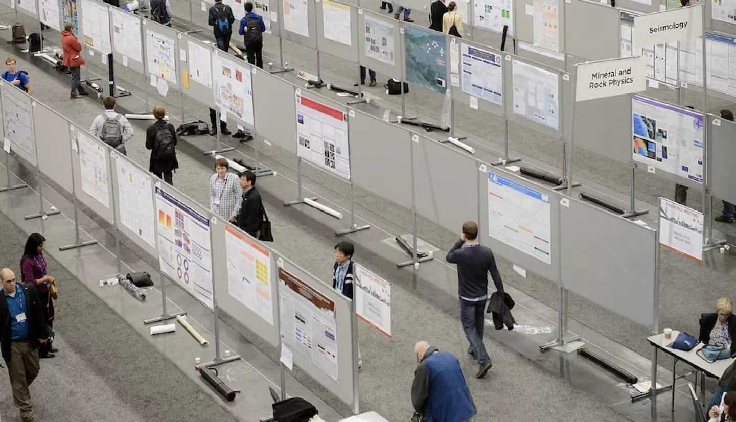 photo of hall with bulletin boards and people