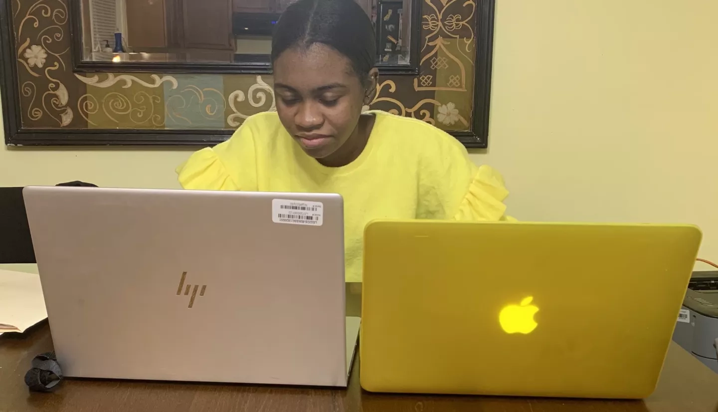 Woman with two laptops