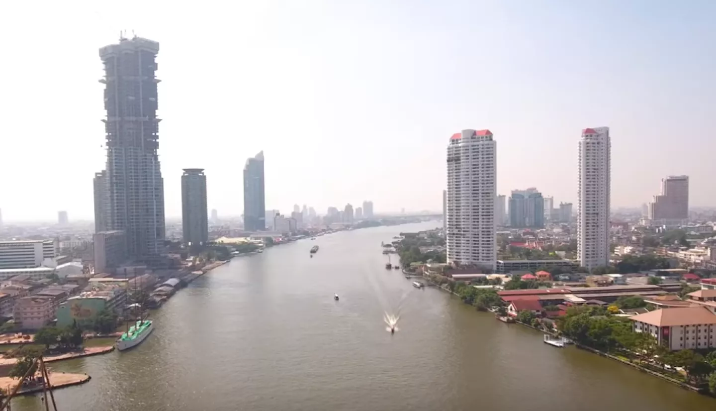 a photo of a river flowing through the city of Bangkok, Thailand.