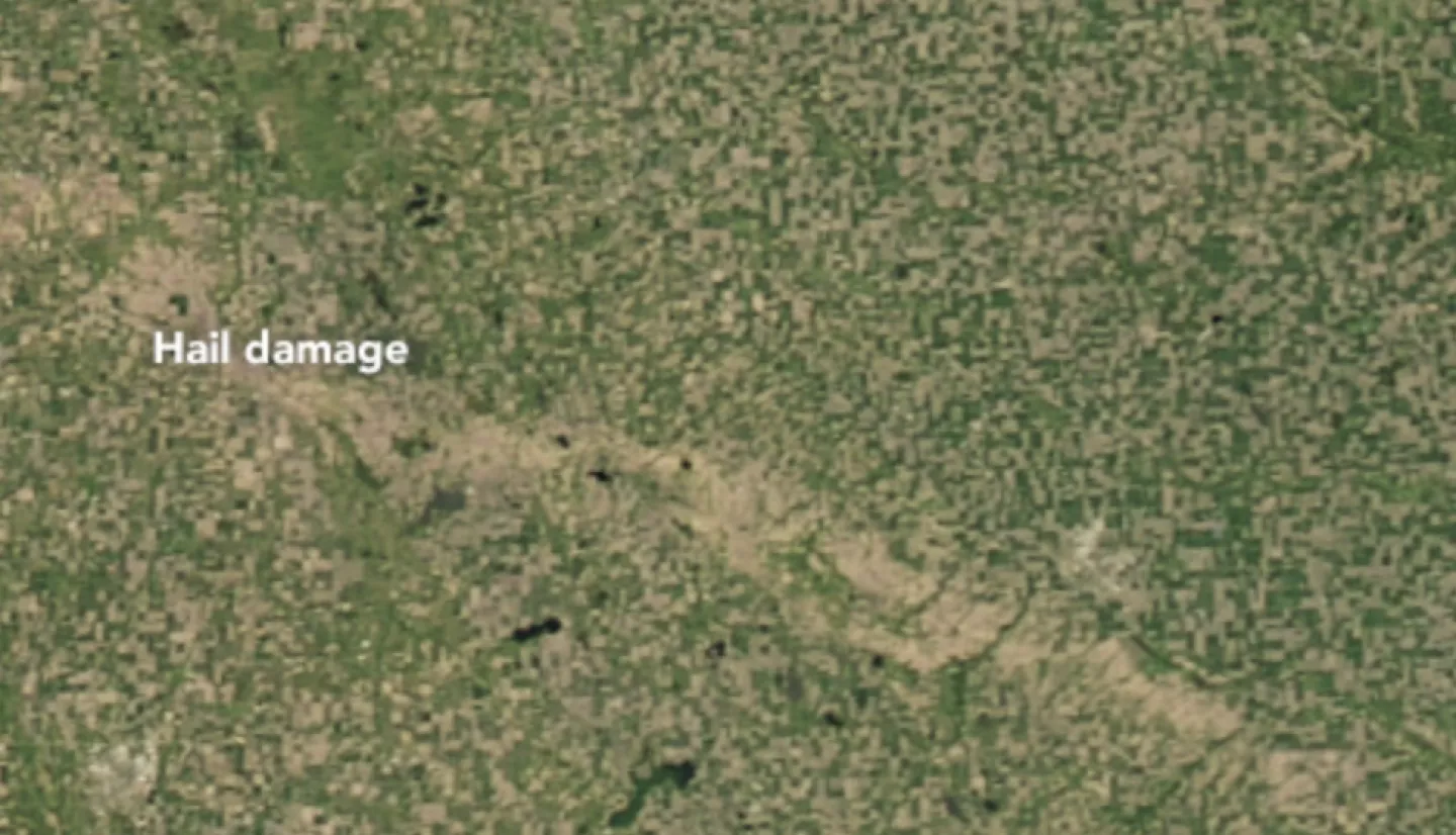 satellite image showing a scar across the land from a hailstorm