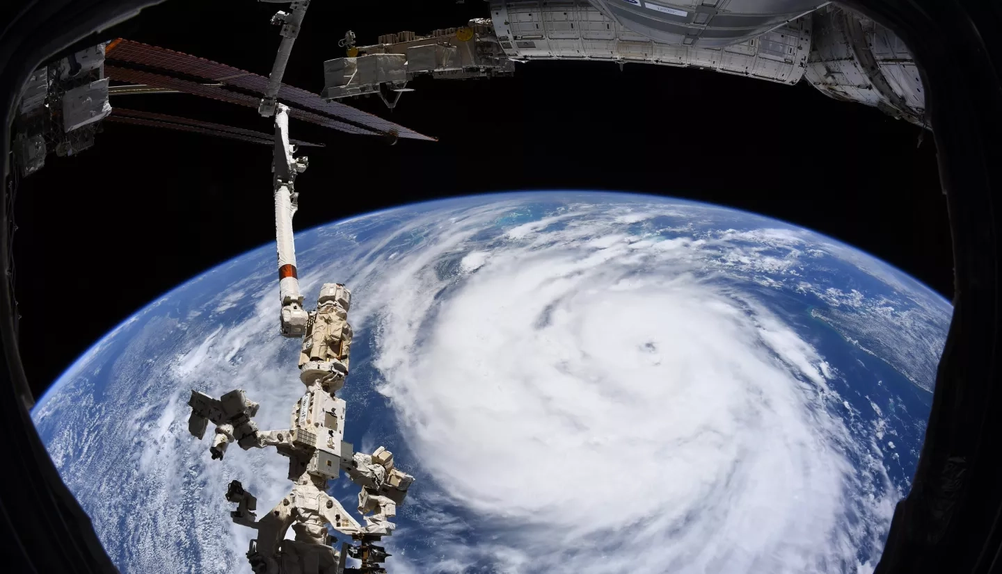 Hurricane Ida is pictured as a category two storm from the International Space Station as it orbited 263 miles above the Gulf of Mexico. At left, from top to bottom, are the Nauka multipurpose laboratory module, the Soyuz MS-18 crew ship and the Northrop Grumman Cygnus space freighter. Credits: NASA, International Space Station