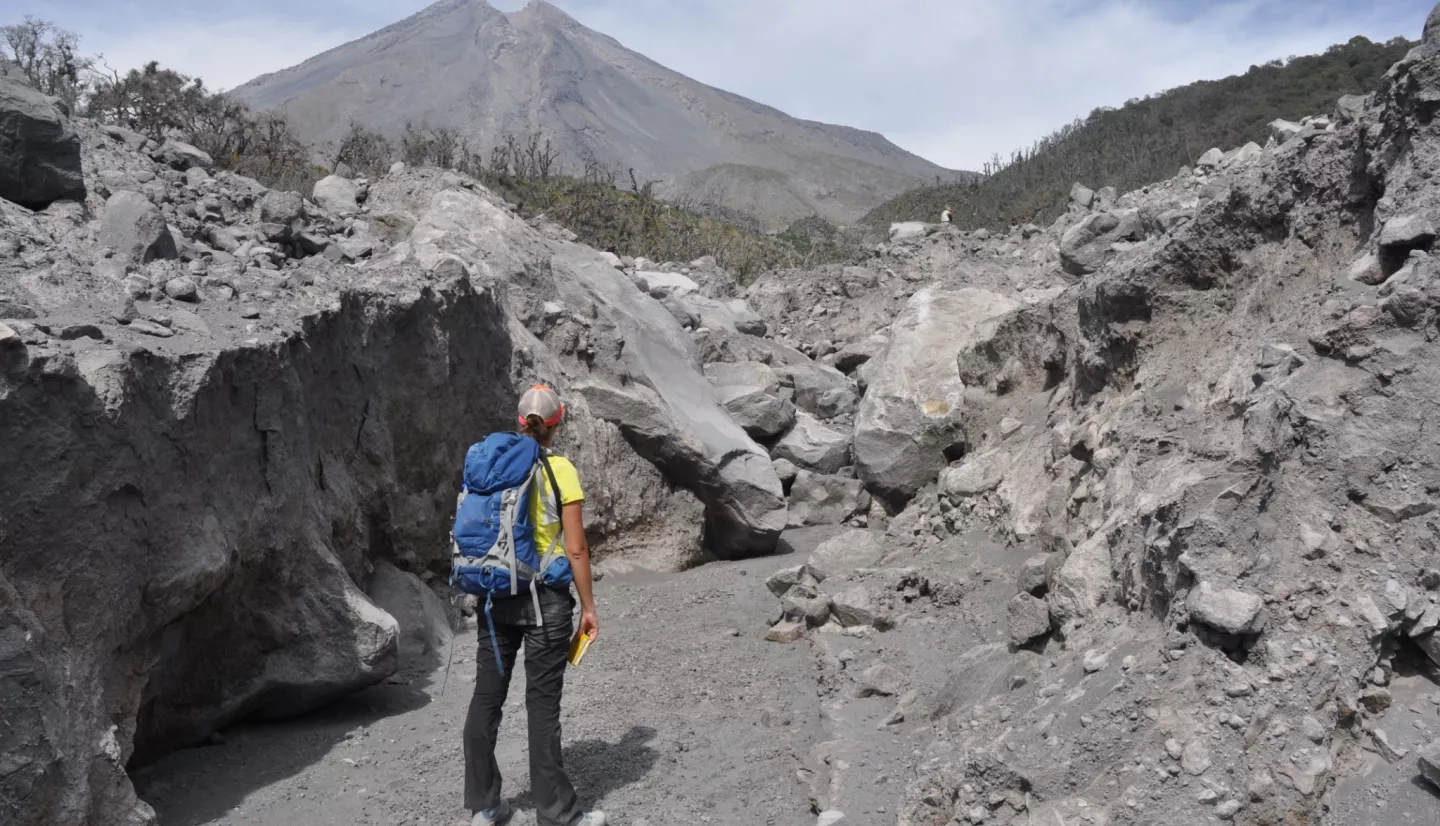 Macorps walks toward the Colima Volcano in Mexico while conducting fieldwork for her Ph.D. in 2016. Credits: Elodie Macorps