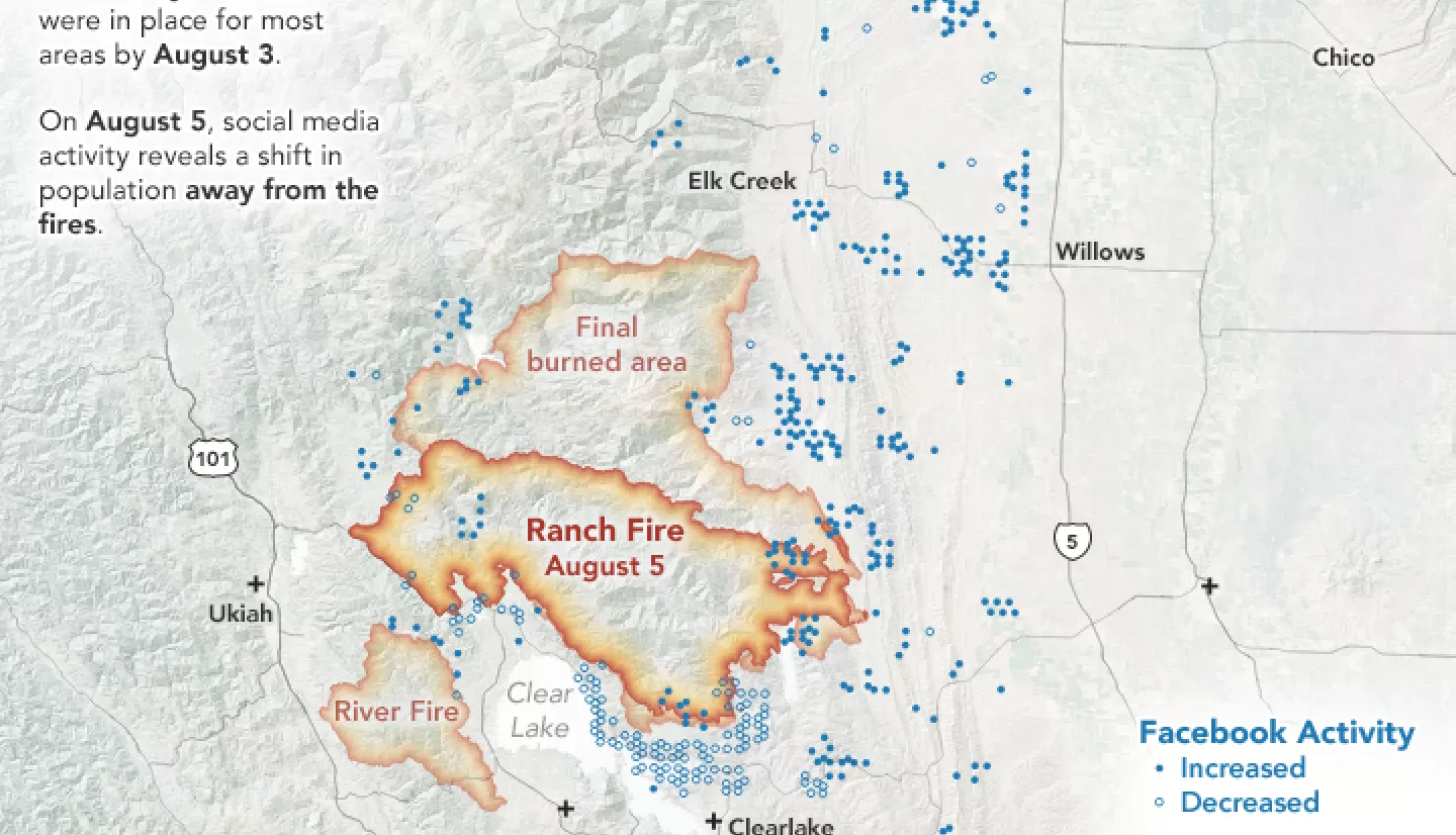 Map using blue dots to indicate facebook activity in different spots with an orange overlay showing the reach of a nearby fire