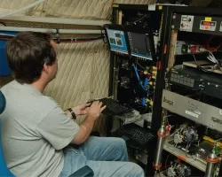 An unidentified researcher works aboard the P-3B NASA research aircraft at Baltimore/Washington International Thurgood Marshall Airport,