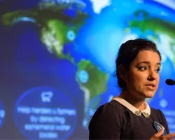 Africa Flores, Land Cover and Land Use Change Theme Lead for SERVIR, speaks during the 2018 Annual Earth Science Applications Showcase