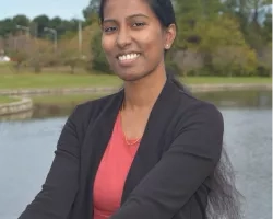 Woman in front of duck pond