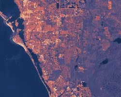 Albedo derived from Landsat 8 & 9 OLI data throughout summer 2019 to 2023. White beige pixels signify effective solar radiation reflection (higher albedo), followed by peach, violet, and dark purple. This data is input for the InVEST Urban Cooling model, which calculates heat dissipation efficiency. Light-colored roofs and dense vegetation can increase albedo. Urban areas with lots of purple patches may be more vulnerable to heat, making them a priority for heat mitigation efforts.