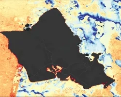 Surface temperature calculated from Landsat 8 data. This image of the waters of Oahu, Hawaii was taken in September of 2022. Shades of blue denote areas of lower surface temperatures, while the shades of yellow to red indicate higher temperatures. These calculations provide resource managers data in making informed decisions for sustainable coastal fishpond management.