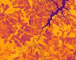 Normalized difference vegetation index (NDVI) calculated based on a Landsat 8 composite of 2021 median reflectance. The image depicts soybean plantations in Mato Grosso, Brazil. NDVI can be used as an indicator of crop productivity and vegetation health. Shades of bright and dark orange indicate vegetated land surfaces, while dark purple areas highlight water surfaces or urban areas.