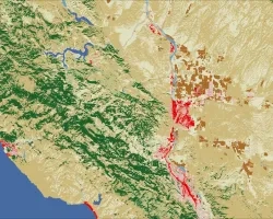 Composite land cover image of the Salinas River Watershed in California, calculated using Landsat 8 OLI and Landsat 9 OLI-2 imagery from November 2022 and November 2023. Red/pink shades indicate developed areas, green shades denote forests, and dark brown/yellow shades signify croplands/grasslands. These characteristics affect surface infiltration capacity and influence overall flood risk.