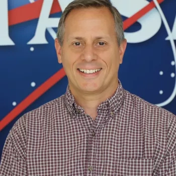 Kevin picutred in front of the original NASA logo