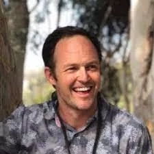 photo of smiling man Ashley Ballantyne